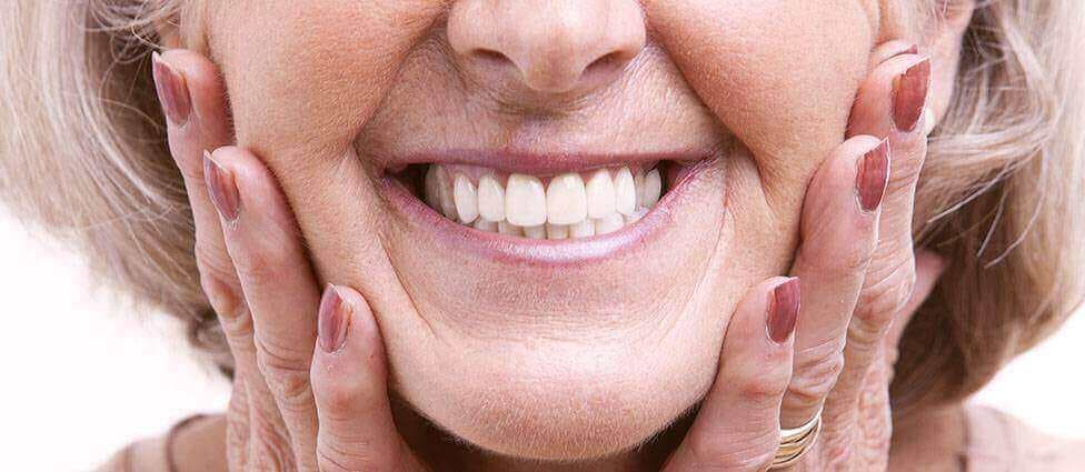 Woman smiling with dentures